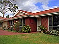 Chez Clark.  Our four bedroom bungalow in sunny Mount Pleasant (ignore those grey clouds in the background).  The previous owner planted forty rose bushes - they smell fabulous.